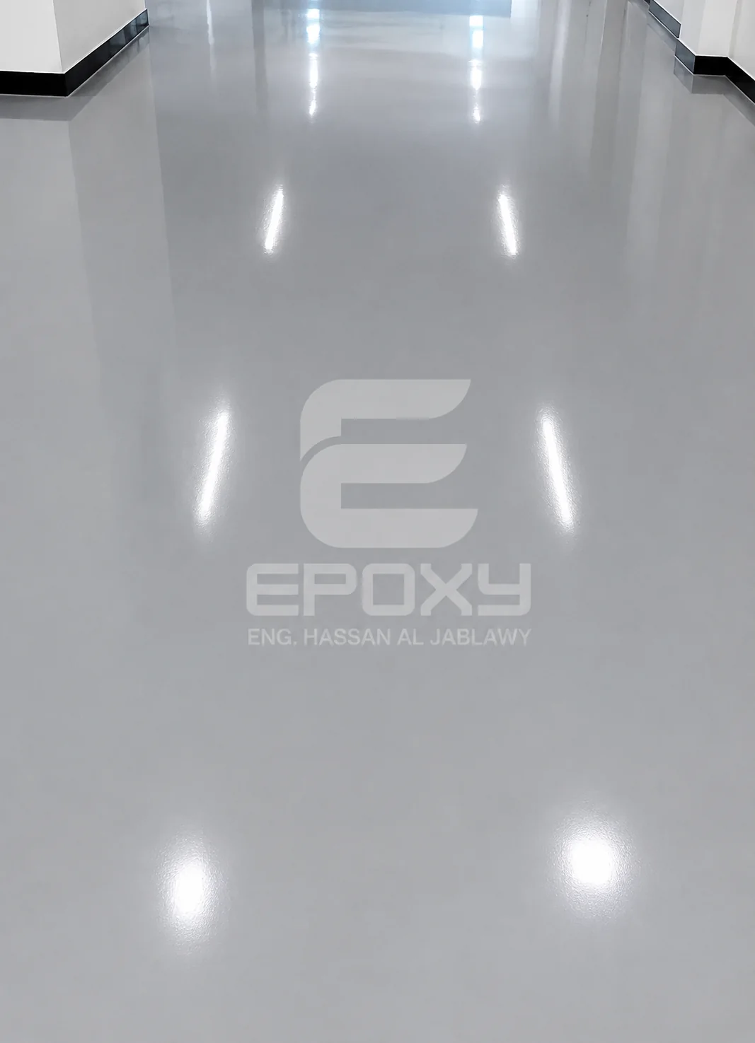 Clean white epoxy floor inside the Al Hamza warehouse