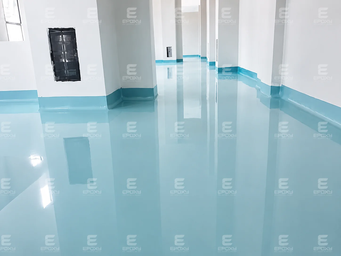 Clean blue self-leveling floor inside a hospital service area