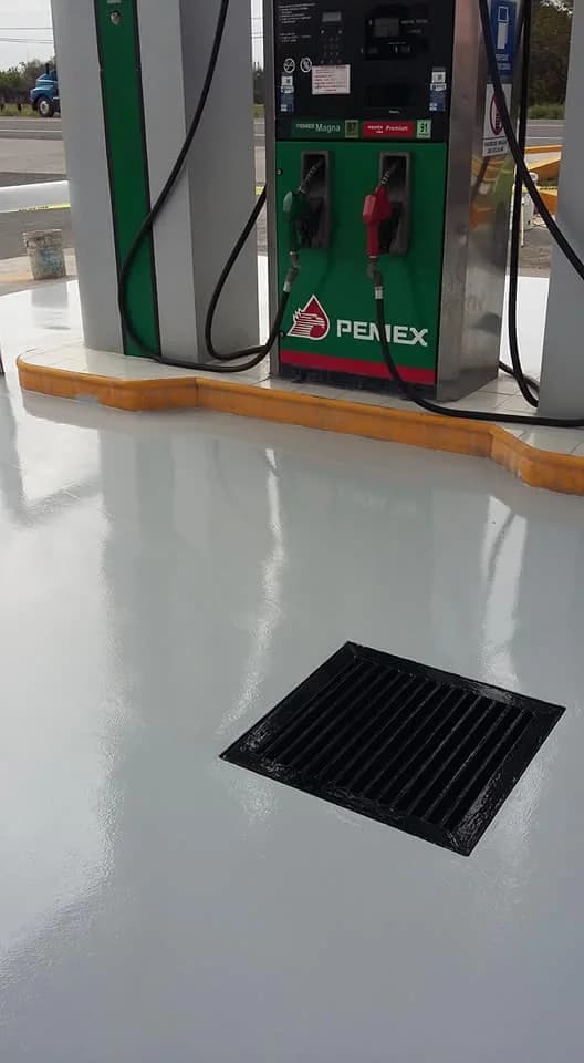 Reflective epoxy floor installed around a fuel station service area